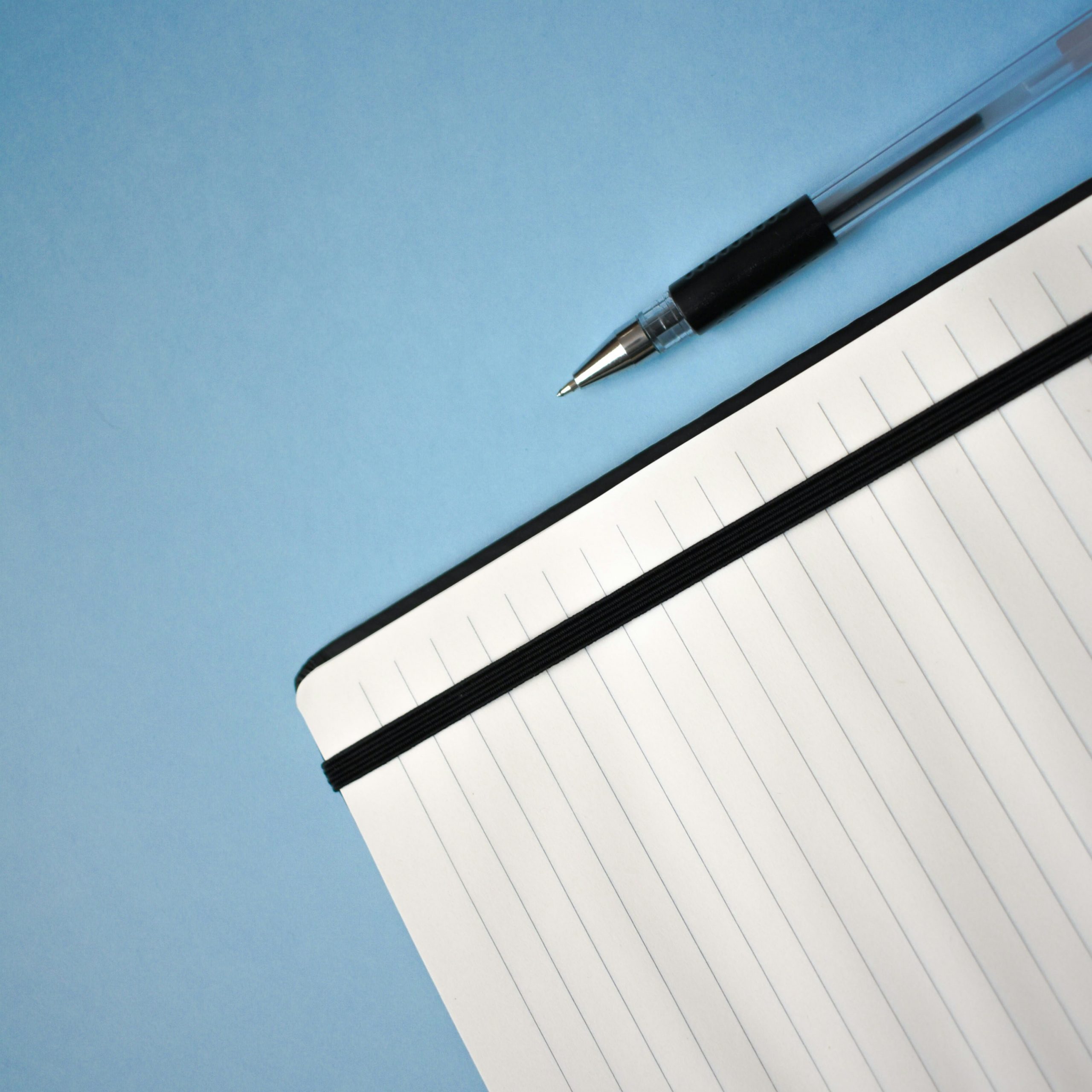 Close up of a checklist on a clipboard with a pen, business context