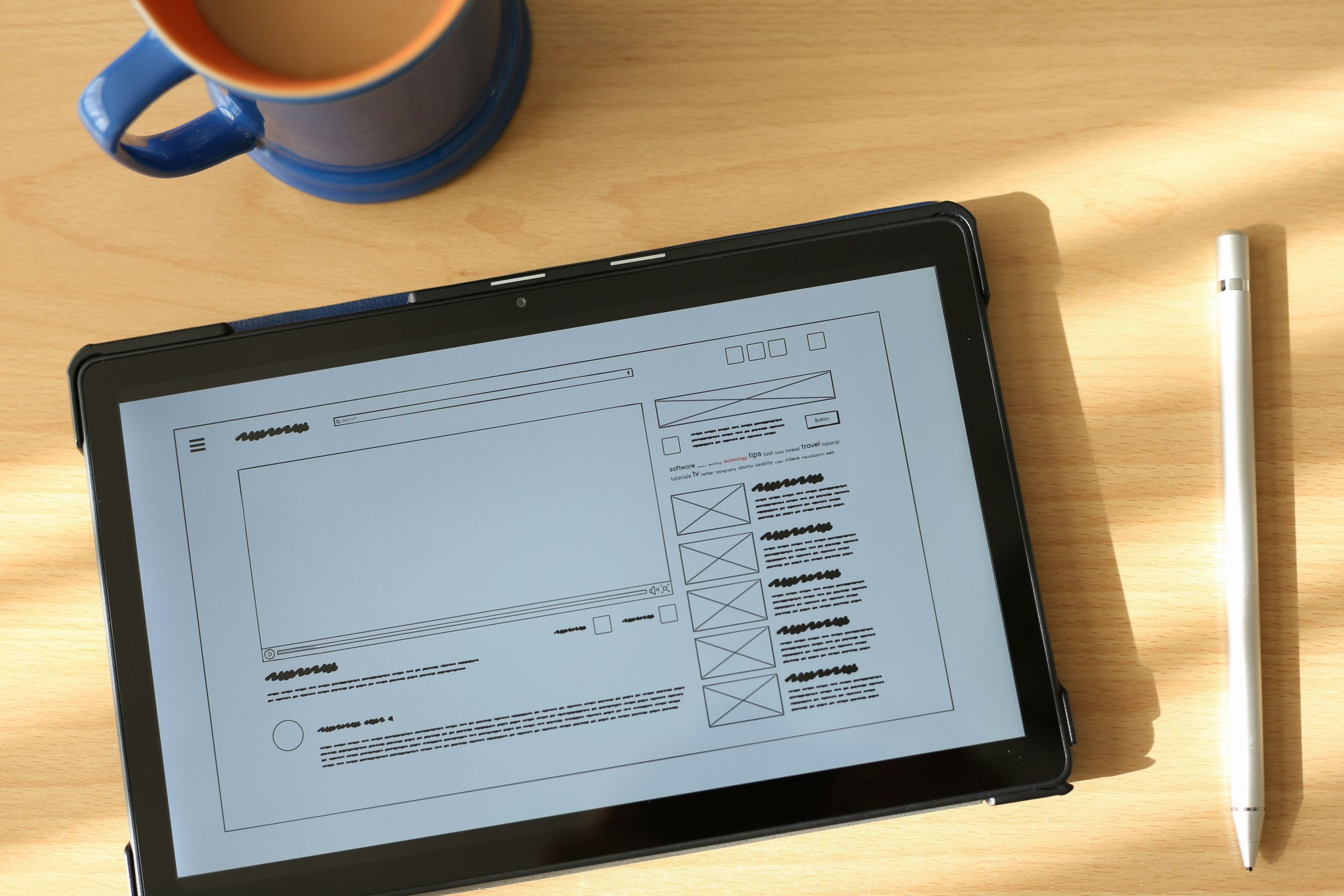 Close up of a business person holding a digital tablet displaying a monthly website performance report with graphs.