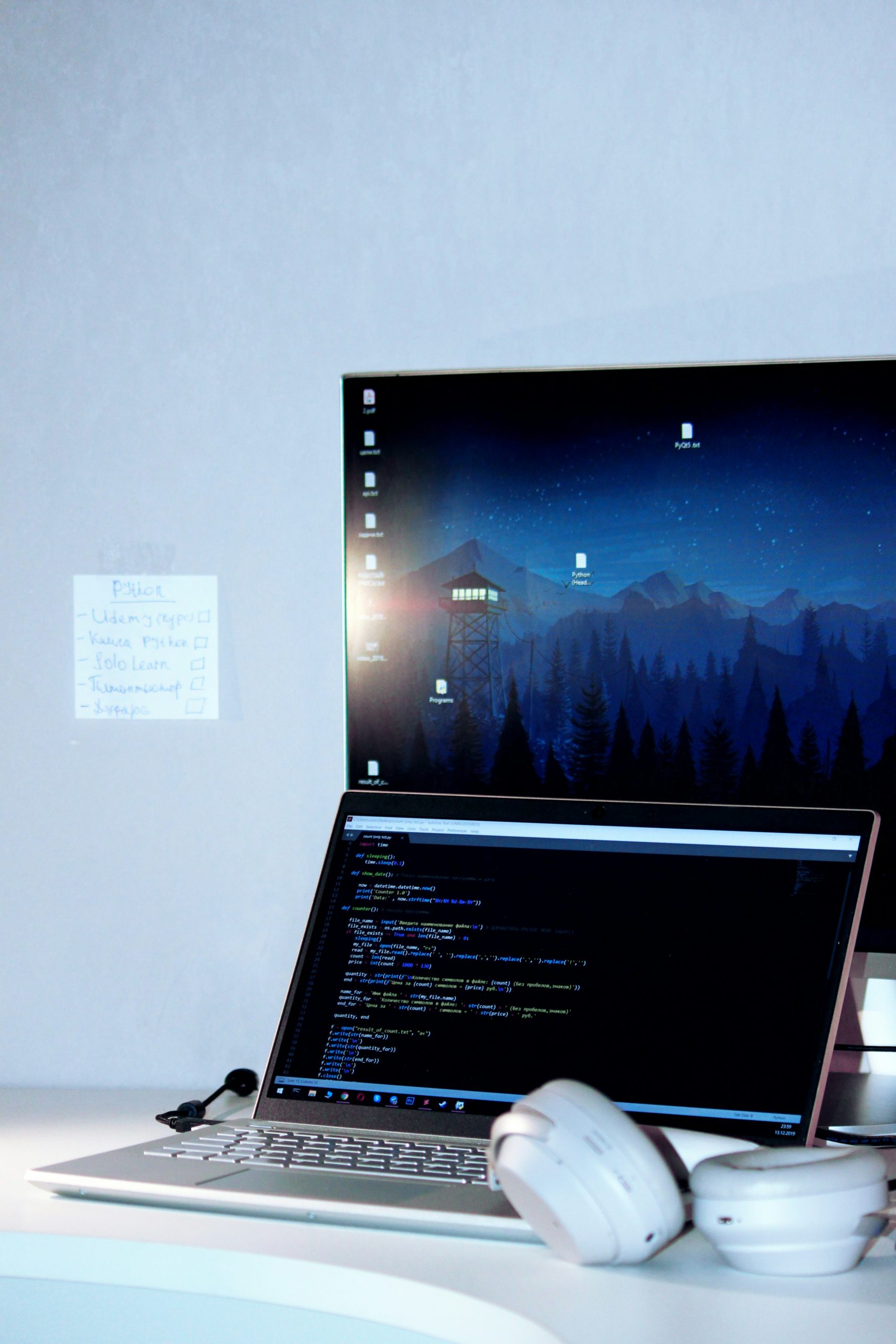 High quality photo of a web designer working on a complex WooCommerce layout on a monitor with code snippets visible.