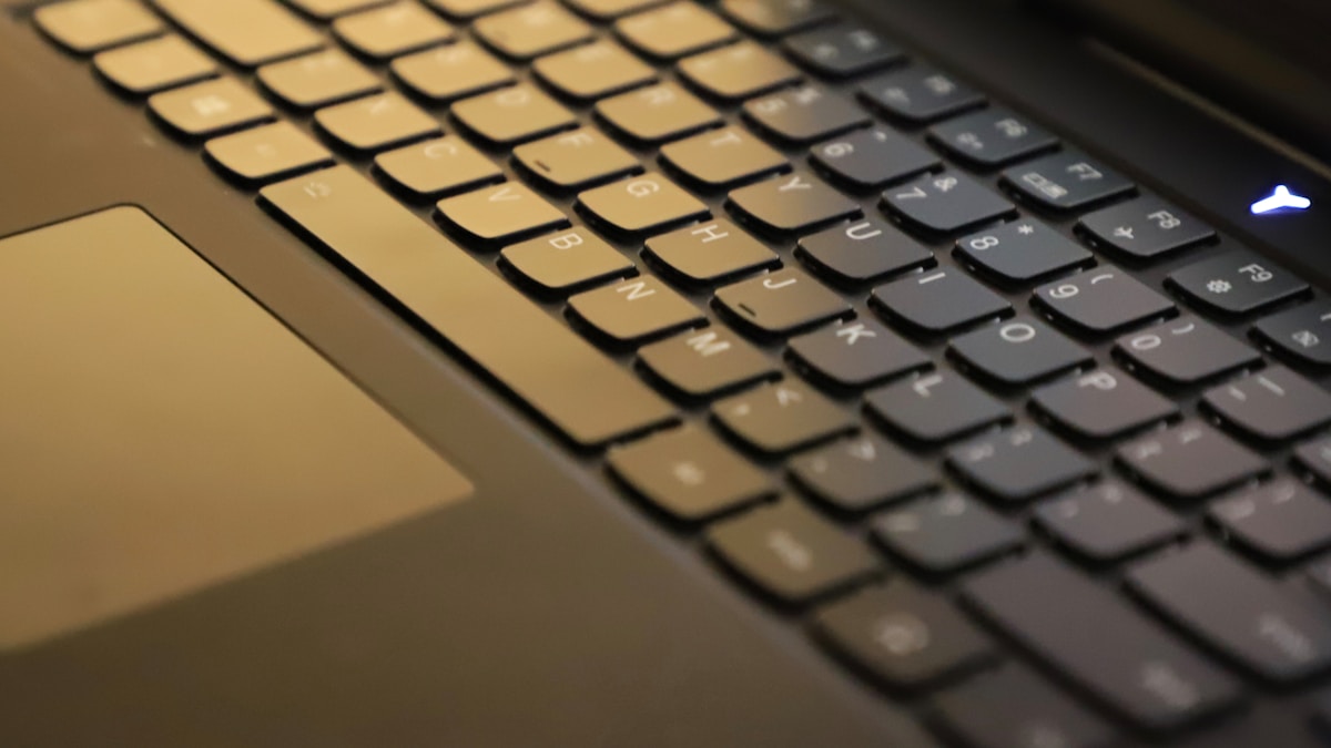 black and yellow laptop computer