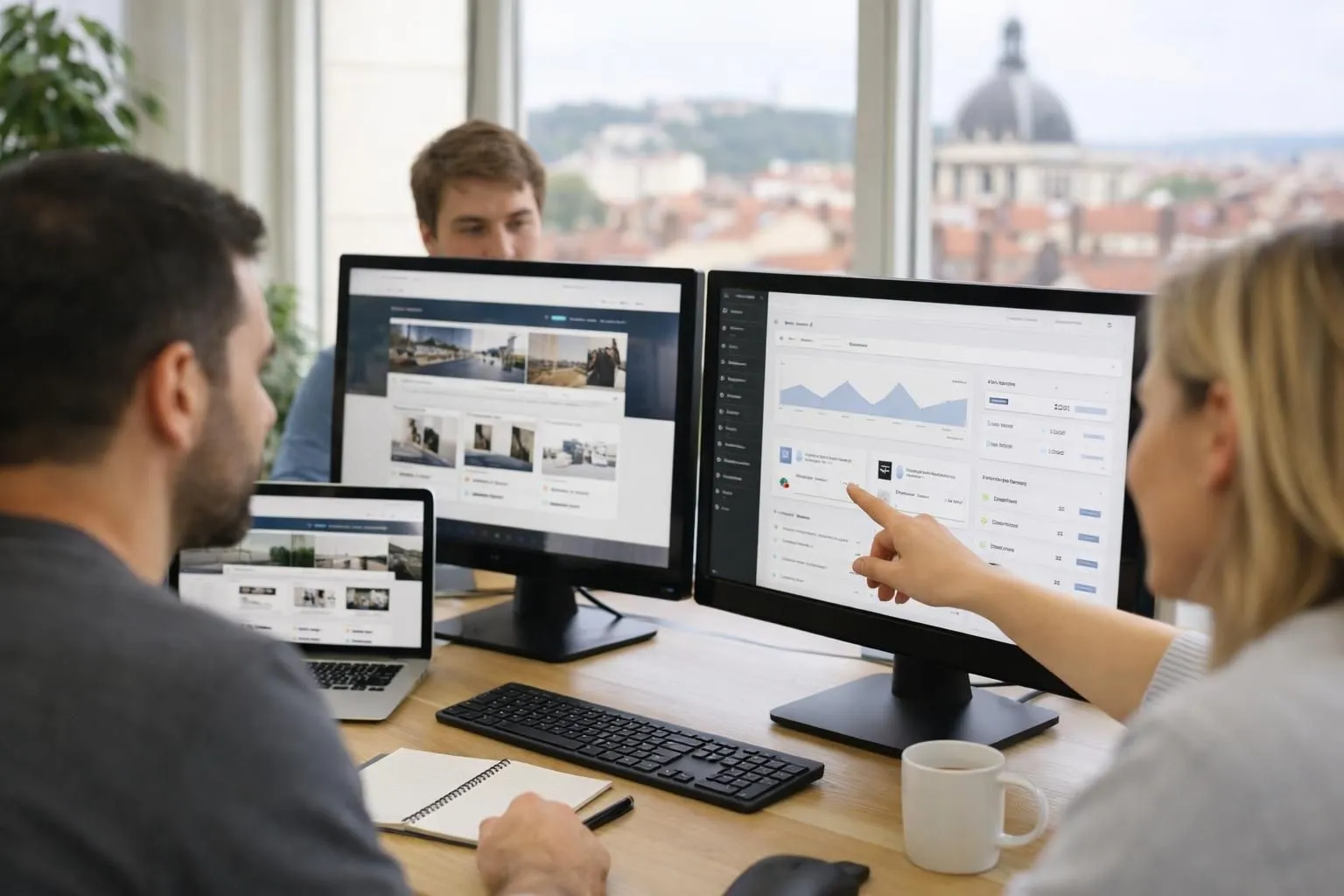 Professional web development team collaborating on WordPress website creation in modern Lyon office, multiple computer screens displaying custom website designs and e-commerce dashboards, bright natural lighting, teamwork atmosphere, real workplace environment