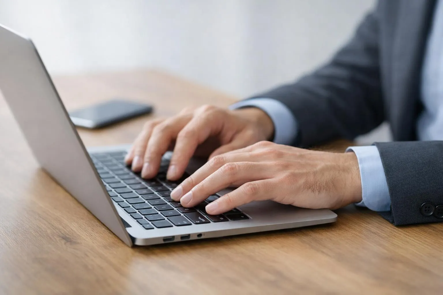 Modern restaurant booking interface displayed on laptop and smartphone screens showing interactive calendar with available time slots, clean minimalist design with burgundy and white colors, wooden table surface visible beneath devices, soft natural lighting, professional product photography style